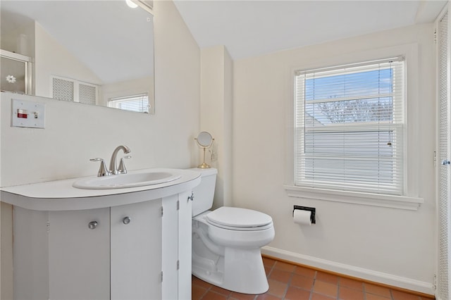 bathroom featuring vanity, tile patterned floors, and toilet