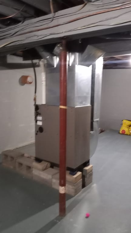 basement featuring heating unit