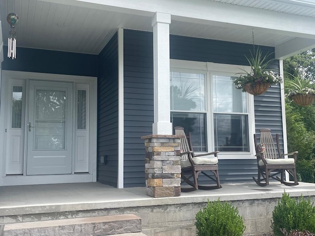 entrance to property featuring a porch