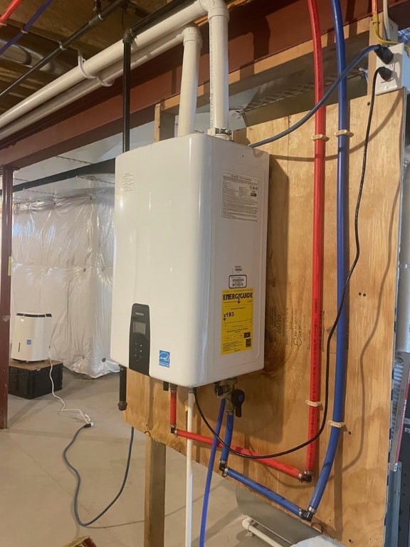 utility room featuring water heater