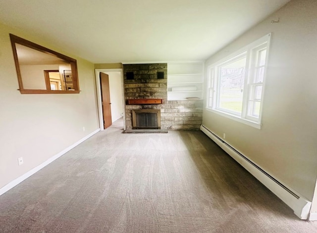 unfurnished living room featuring carpet floors, a stone fireplace, and a baseboard radiator