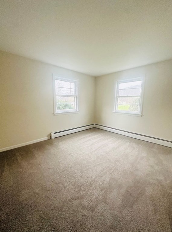 spare room with carpet floors and a healthy amount of sunlight