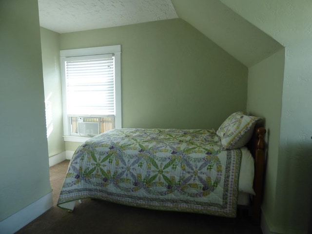 carpeted bedroom with lofted ceiling, cooling unit, and a textured ceiling