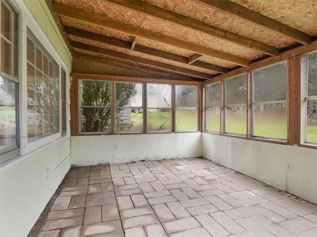 unfurnished sunroom with lofted ceiling