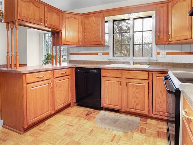 kitchen featuring sink, light parquet floors, black appliances, decorative backsplash, and kitchen peninsula