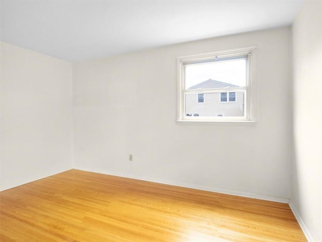 empty room featuring hardwood / wood-style flooring