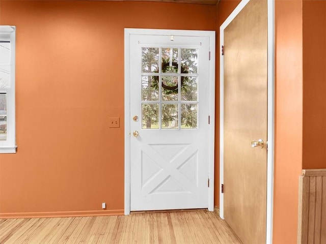 doorway to outside featuring light wood-type flooring