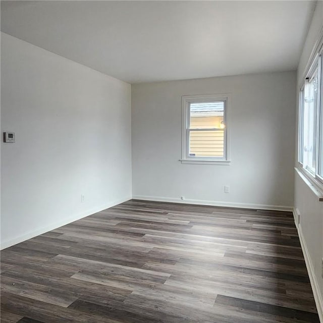 unfurnished room featuring dark hardwood / wood-style floors