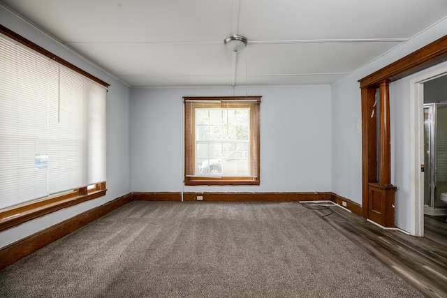 carpeted empty room featuring ornamental molding