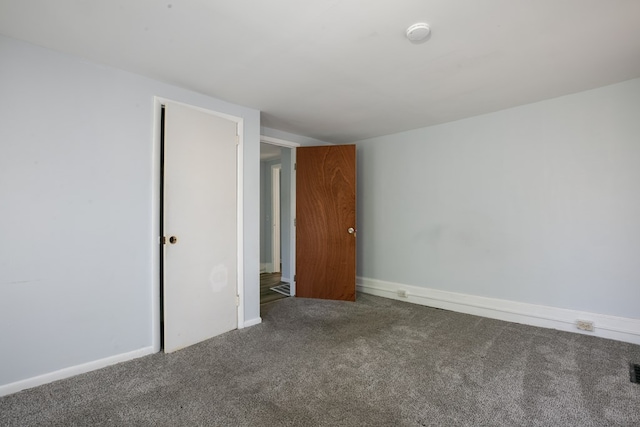 unfurnished bedroom with carpet and a closet