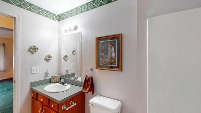 bathroom featuring vanity and toilet