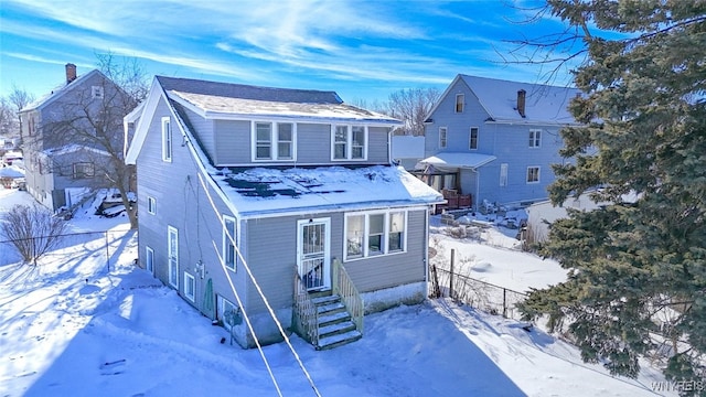 view of snow covered house