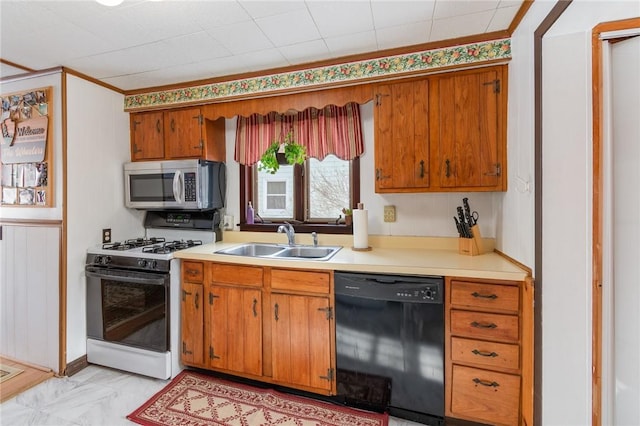 kitchen with sink, white gas stove, and dishwasher