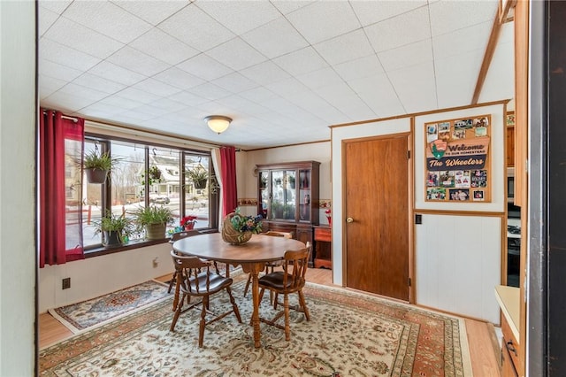 dining space featuring wood-type flooring