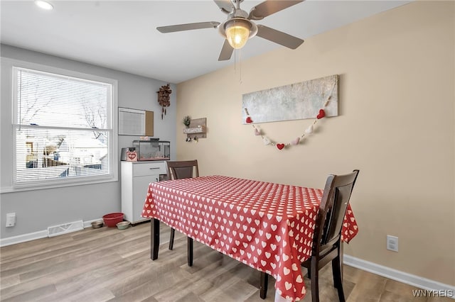 dining room featuring ceiling fan and light wood-type flooring