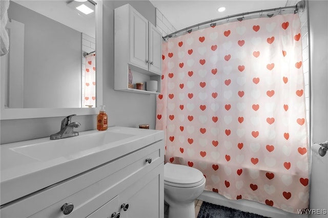 full bathroom with vanity, tile patterned floors, toilet, and shower / bath combo with shower curtain