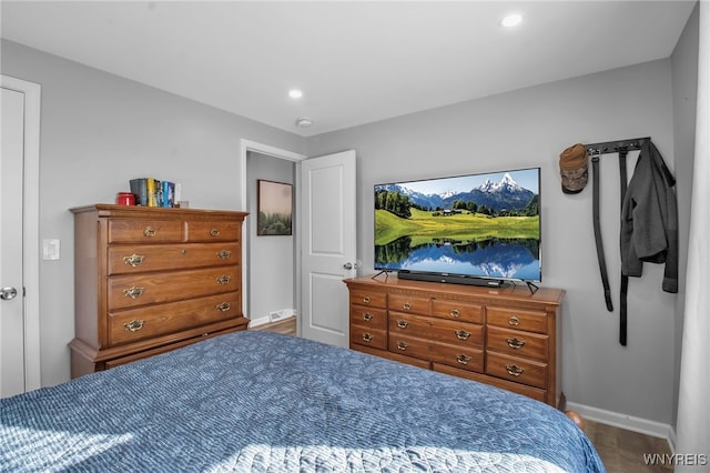 bedroom with hardwood / wood-style floors