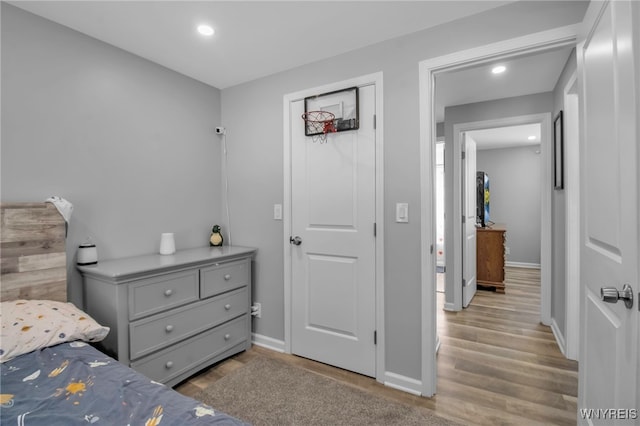 bedroom with light hardwood / wood-style floors