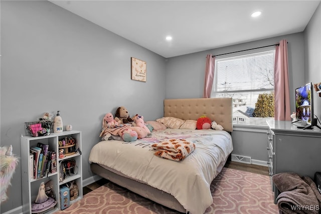 bedroom with light hardwood / wood-style floors