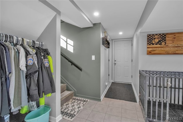 foyer entrance with light tile patterned floors