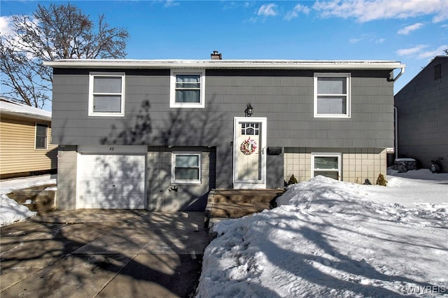 split foyer home featuring a garage