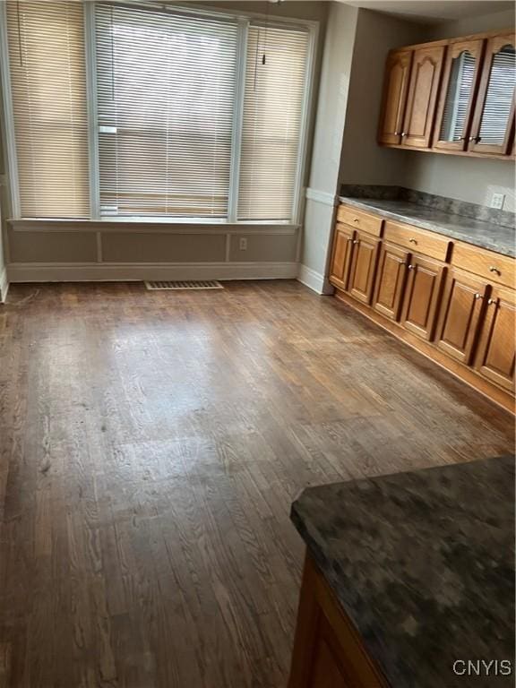 unfurnished dining area featuring hardwood / wood-style flooring