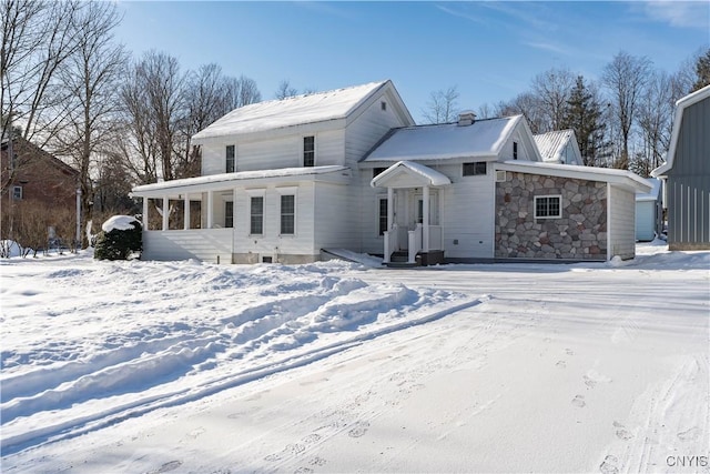 view of snow covered house