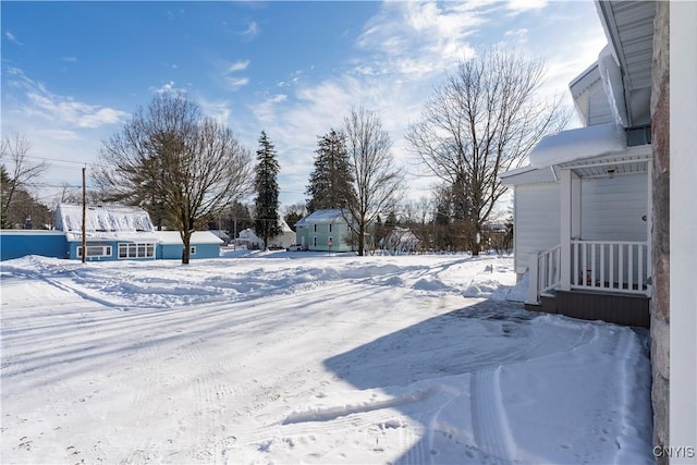 view of yard layered in snow