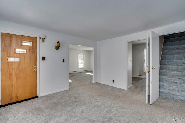 carpeted foyer entrance featuring a baseboard radiator