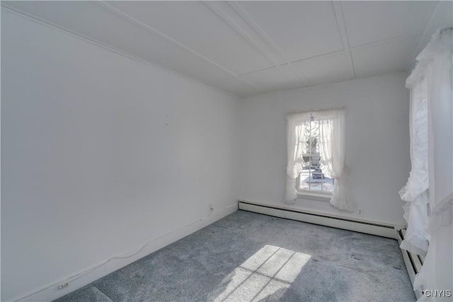 empty room with a baseboard radiator and light carpet