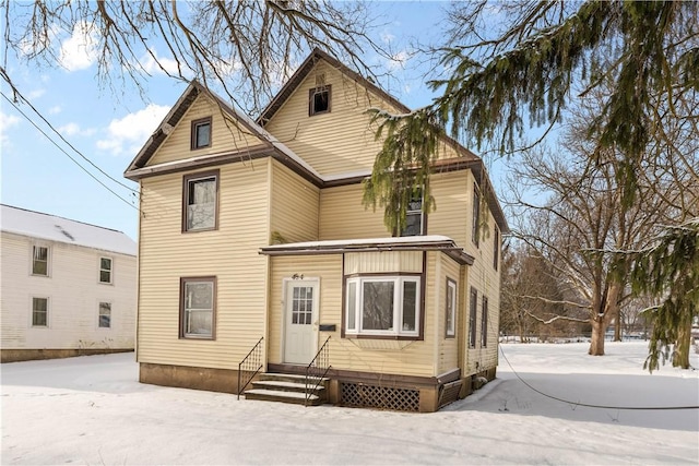 view of snow covered house