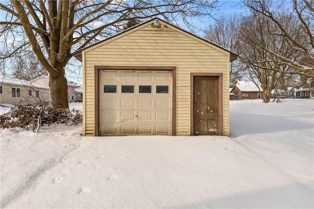 view of snow covered garage