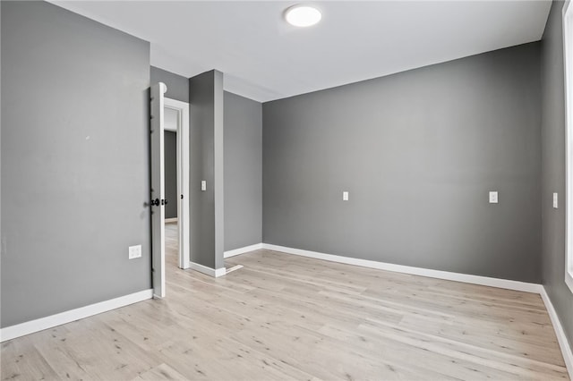 spare room featuring light hardwood / wood-style floors