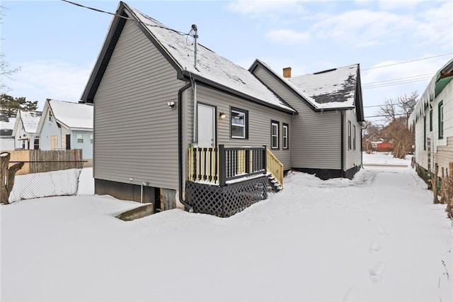 view of snow covered house