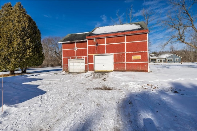 view of snow covered garage