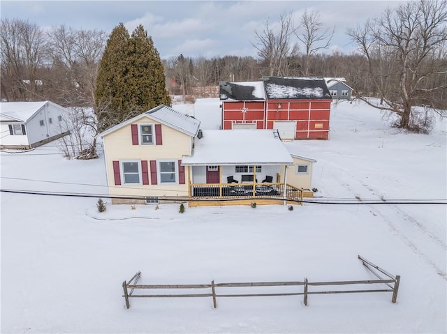 view of snow covered house