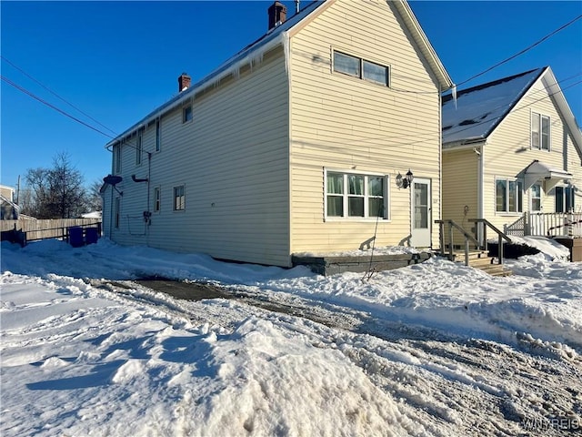 view of snow covered house