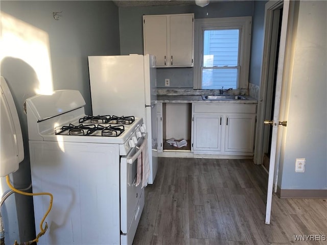 kitchen featuring white cabinetry, white range with gas cooktop, sink, and dark hardwood / wood-style floors