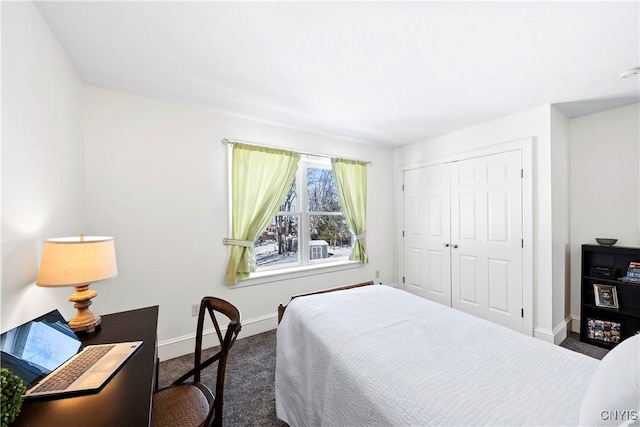 carpeted bedroom featuring a closet