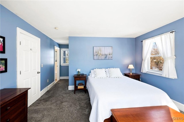 carpeted bedroom featuring multiple windows