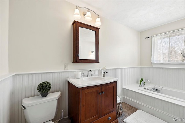 bathroom with tile patterned floors, vanity, and toilet