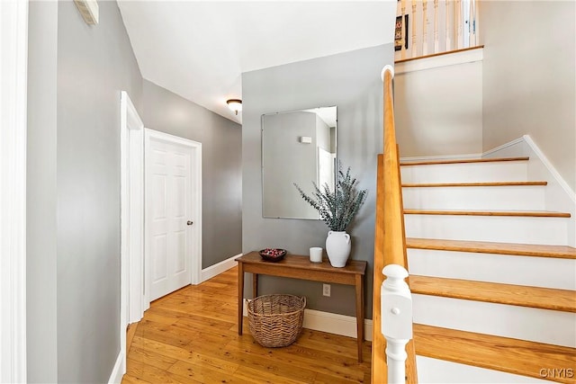 staircase with wood-type flooring