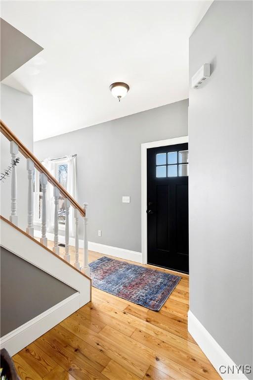 foyer entrance featuring hardwood / wood-style floors