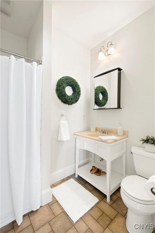 bathroom with sink and toilet