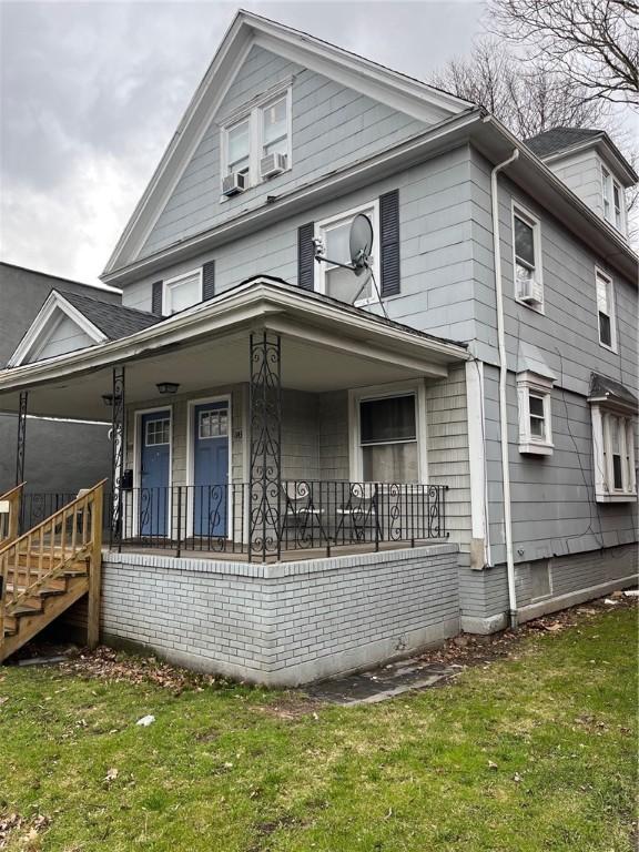 1143-1145 S Plymouth Ave, Rochester, NY 14608 - american foursquare style home featuring covered porch and a front yard