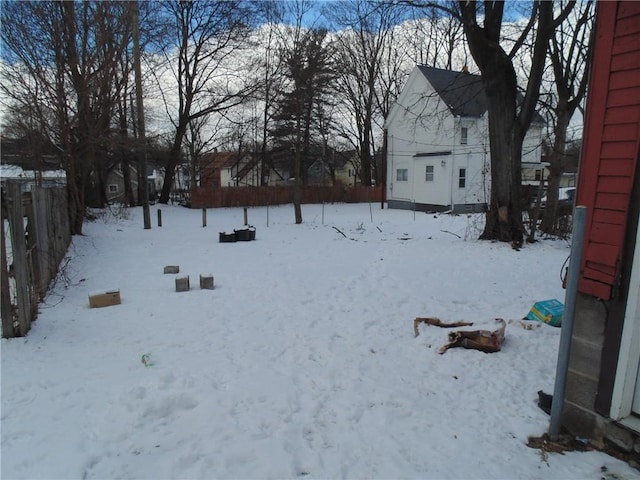 view of yard layered in snow