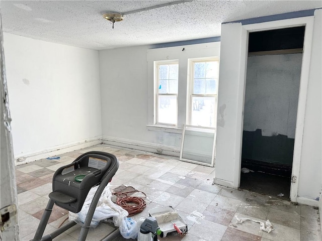 interior space with a textured ceiling