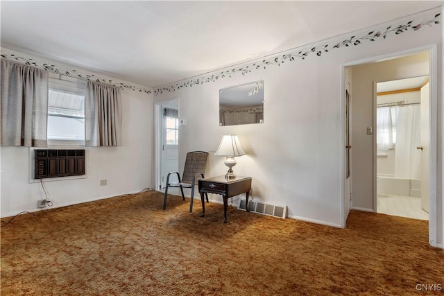 interior space with an AC wall unit and carpet flooring