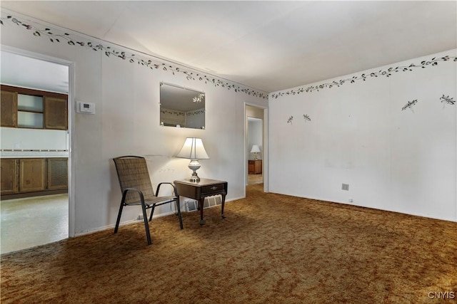 sitting room featuring carpet floors