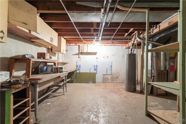 basement featuring a workshop area and water heater